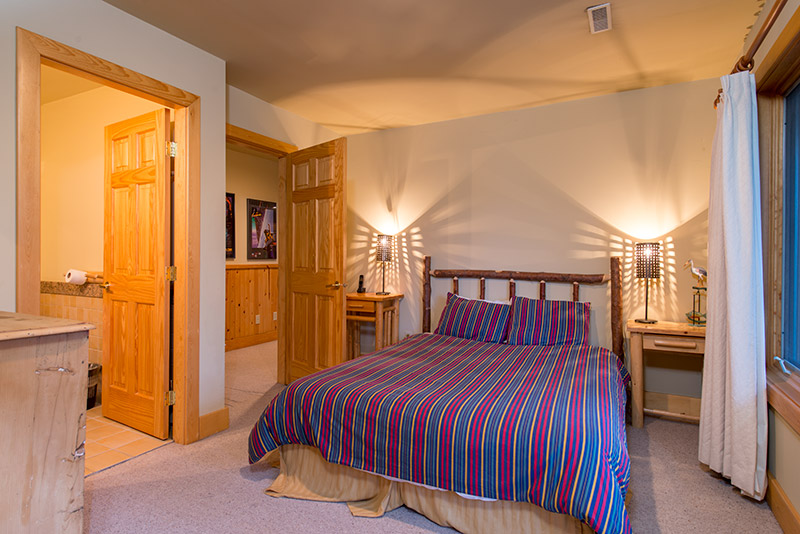 Master log bedroom with king size log bed and ensuite bathroom