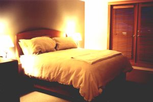 Master bedroom with king size bed and ensuite bathroom with heated slate floor
