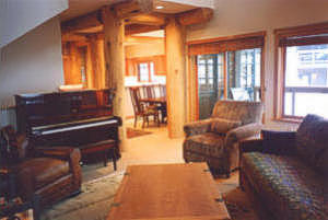 Piano and leather furnishings to round out the holiday lodging scene